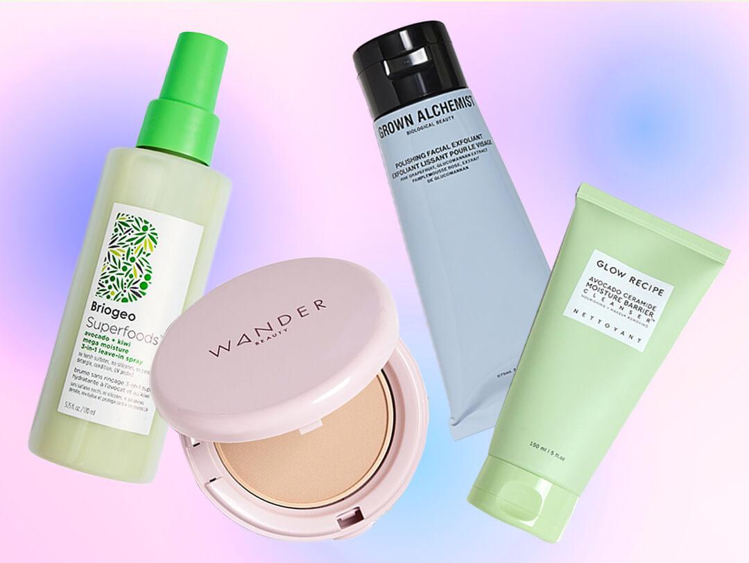 Skincare and makeup products from various brands on colorful background Desktop
