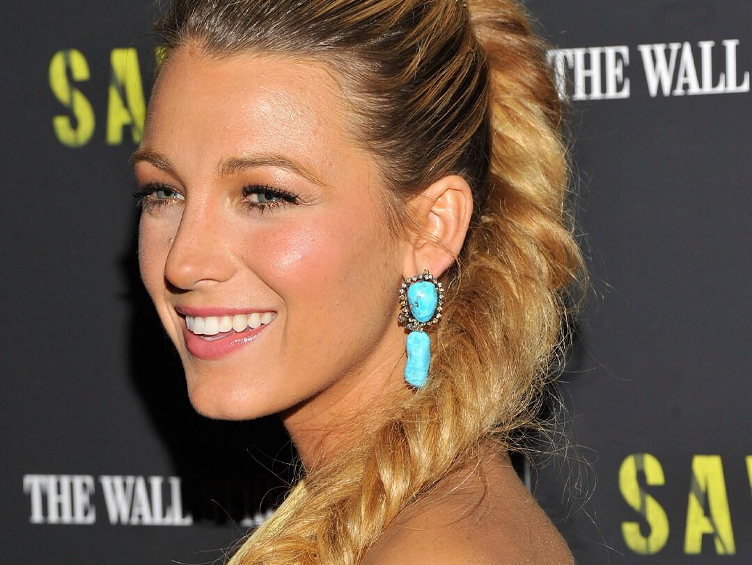 Close-up of Blake Lively rocking fishtail braids, a no-makeup makeup look, and turquoise dangling earrings on the red carpet Desktop