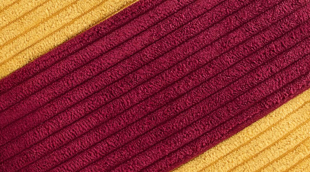 Close-up image of red and yellow corduroy Desktop
