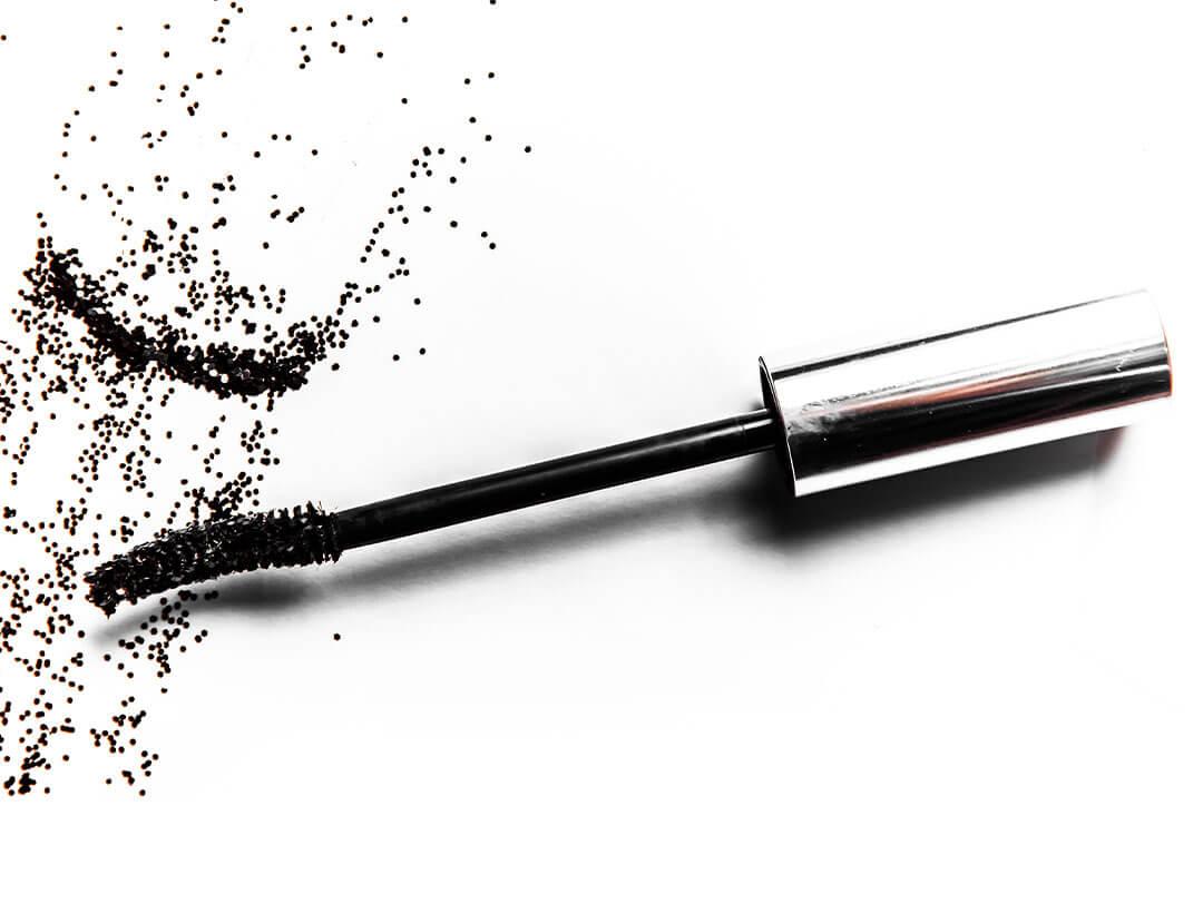 A close-up image of a black mascara in a white backdrop Desktop