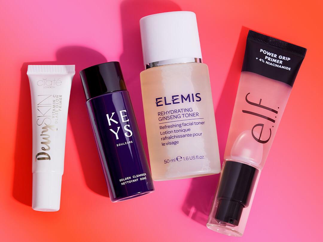 Beauty products from the July 2023 IPSY Glam Bag on gradient pink and orange background Desktop