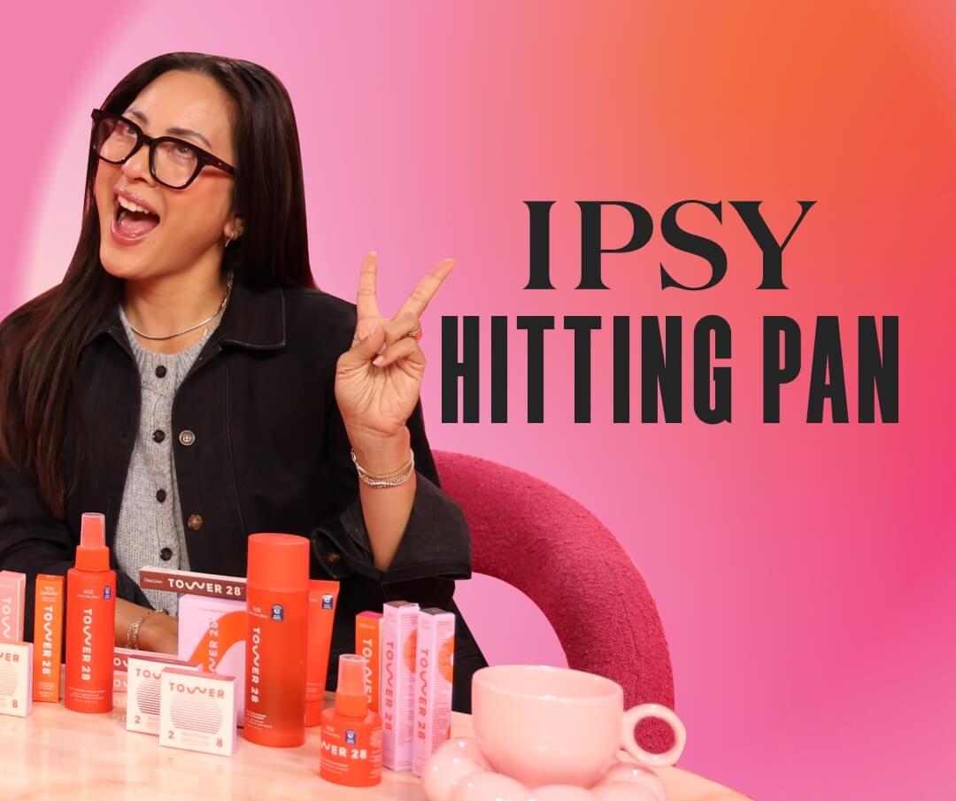 Amy Liu holding up a peace sign on the pink set of Hitting Pan Desktop