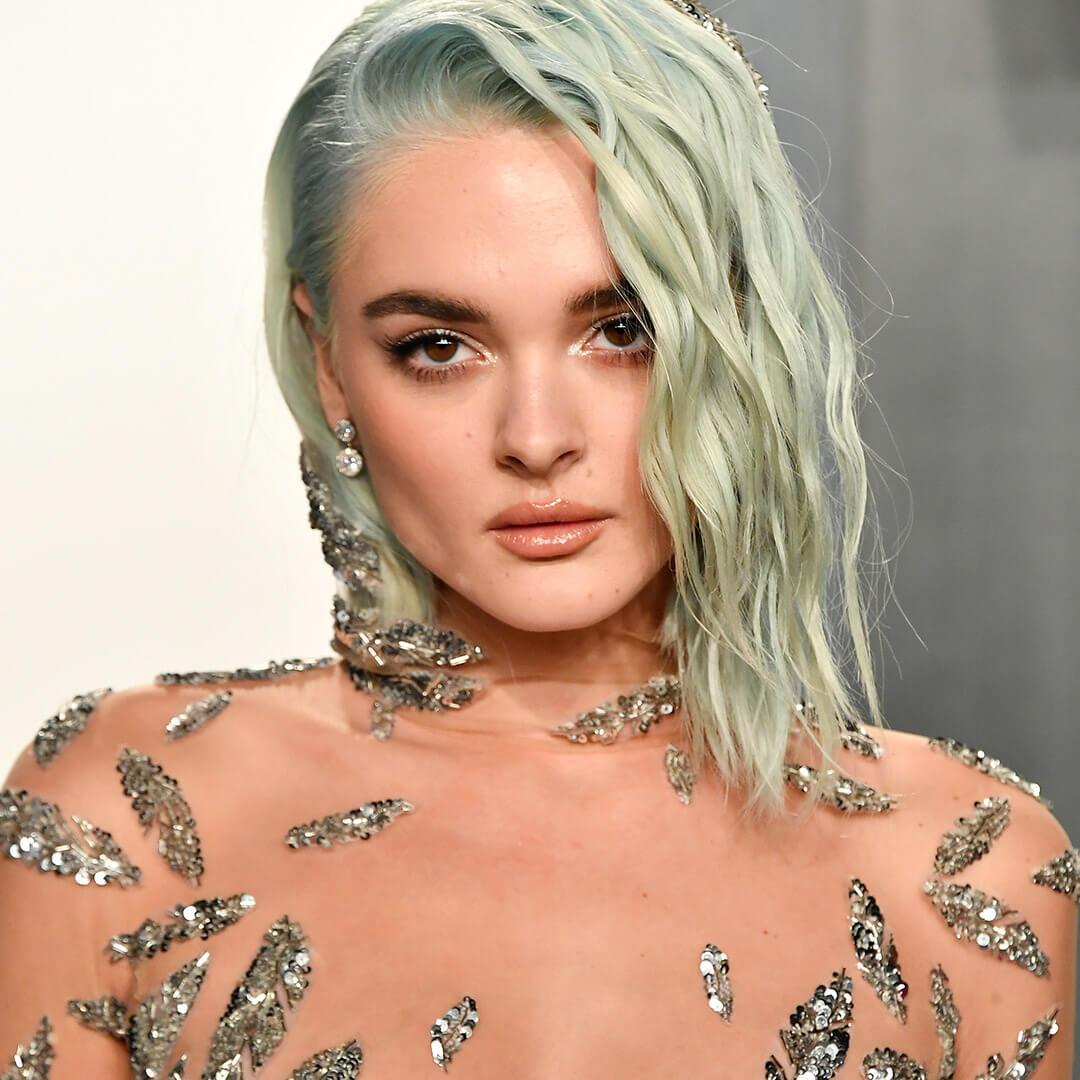 A photo of Charlotte Lawrence and her light green hair with waves Desktop