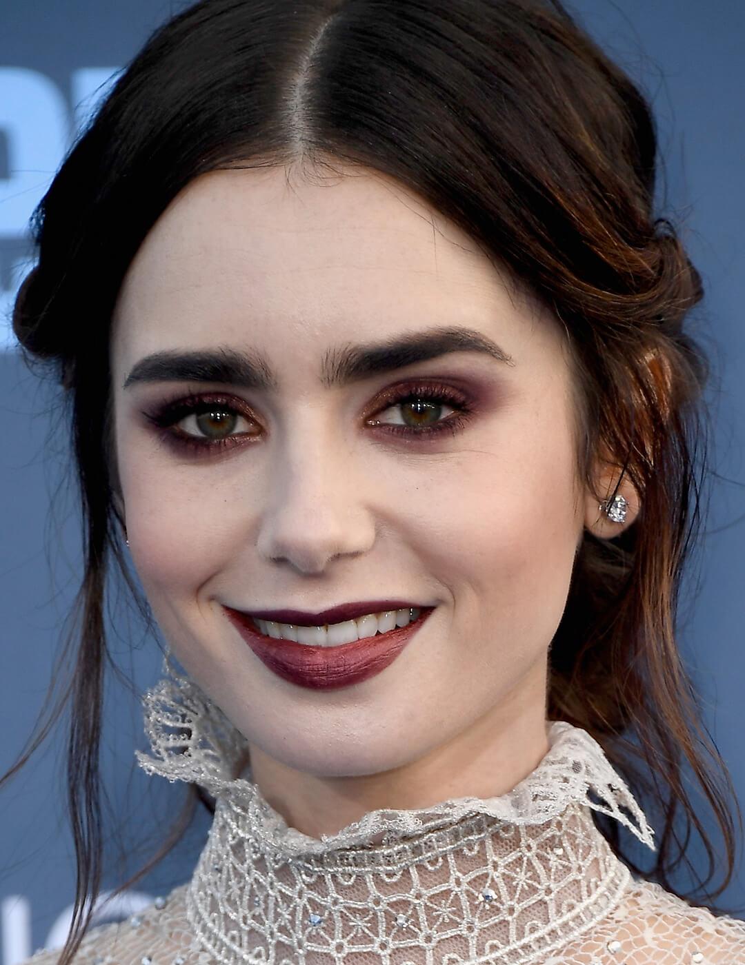 Close-up of Lily Collins rocking a very deep burgundy eyeshadow look Desktop