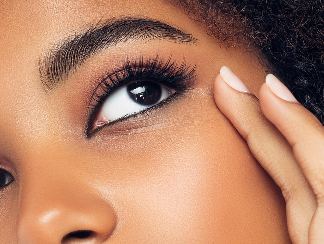 A closeup photo of a model's eyes with long eyelashes Desktop