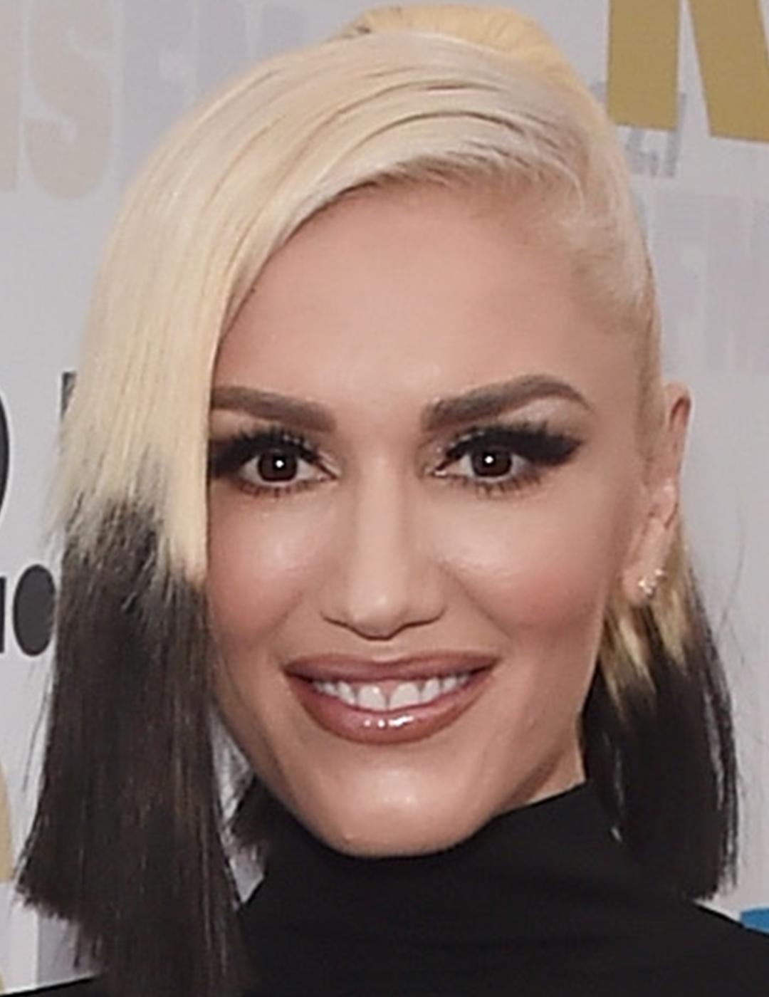 A photo of Gwen Stefani with blonde hair and black ends Desktop