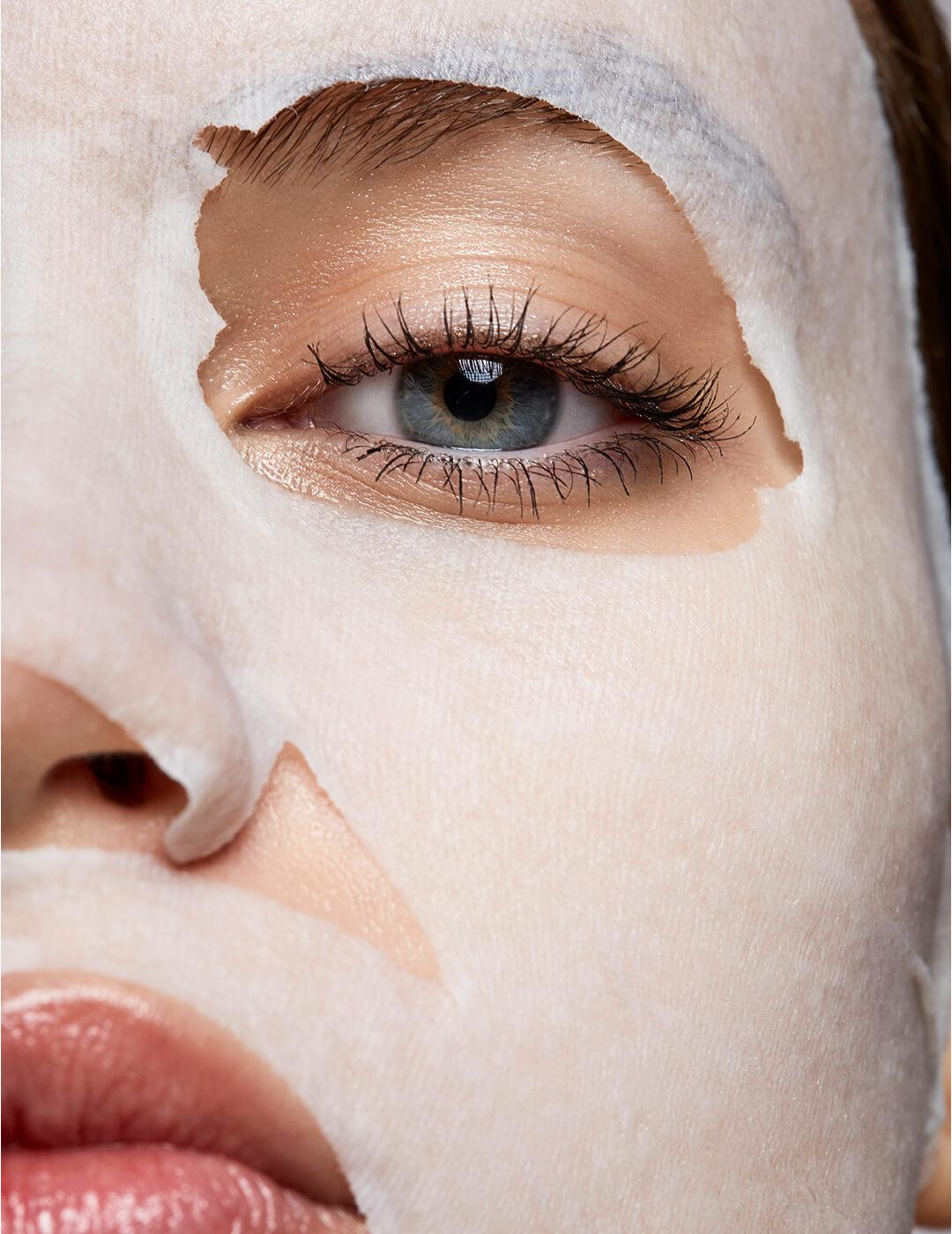 Woman wearing a moisturizing sheet mask Desktop