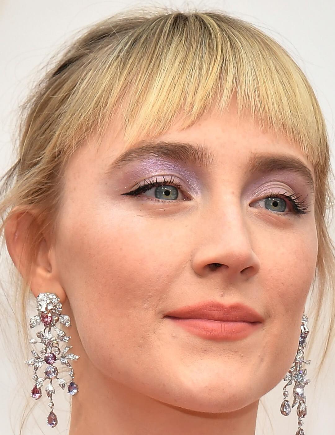 A photo of Saoirse Ronan showing her combined blue and purple eyeshadow on a white background Mobile