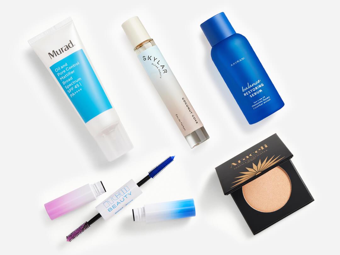 Makeup, beauty, and skincare products from the July 2022 IPSY Glam Bag Plus on white background Desktop