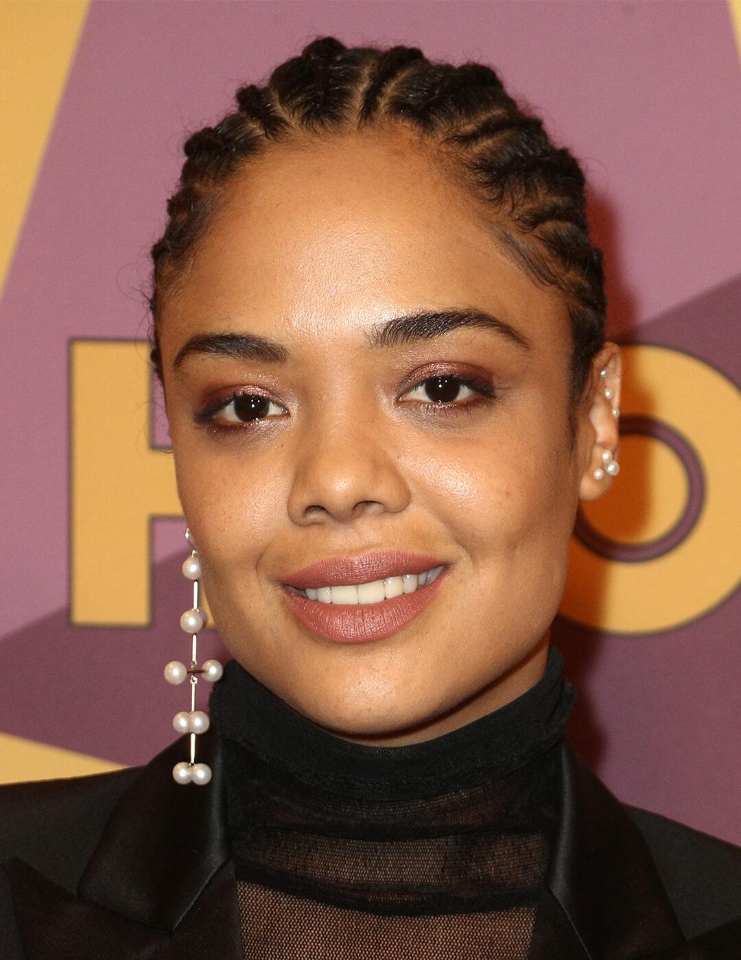 Tessa Thompson rocking a cornrows hairstyle Desktop