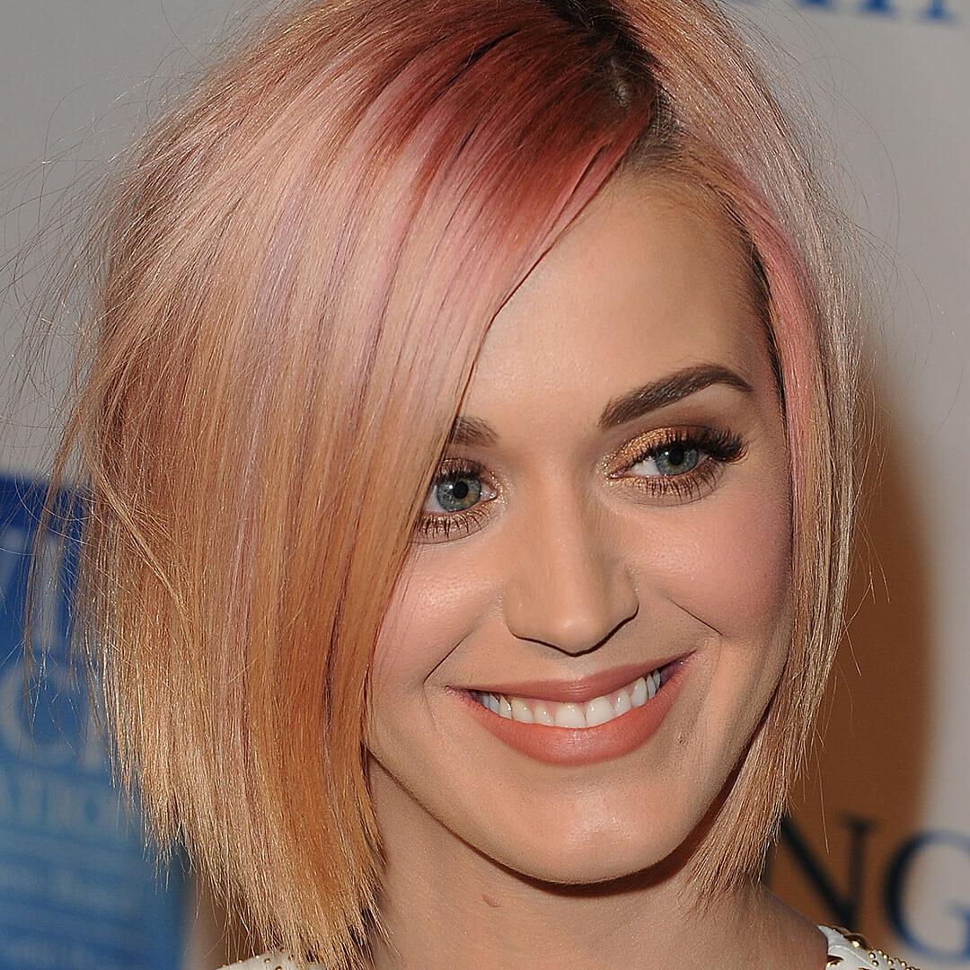 A photo of Katy Perry with bubblegum pink roots Mobile