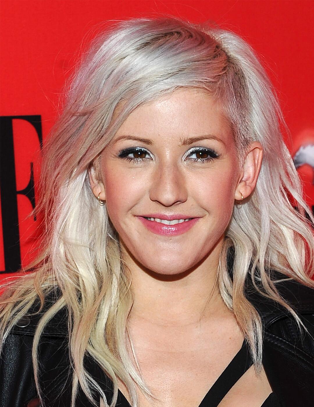 A photo of Ellie Goulding with a hidden undercut hairstyle waring a black dress Mobile