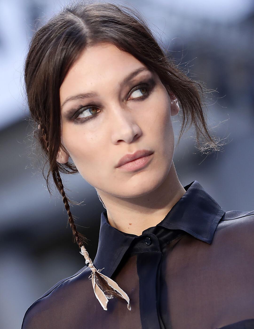 Bella Hadid rocking a micro accent braid hairstyle with ribbons at the end Mobile