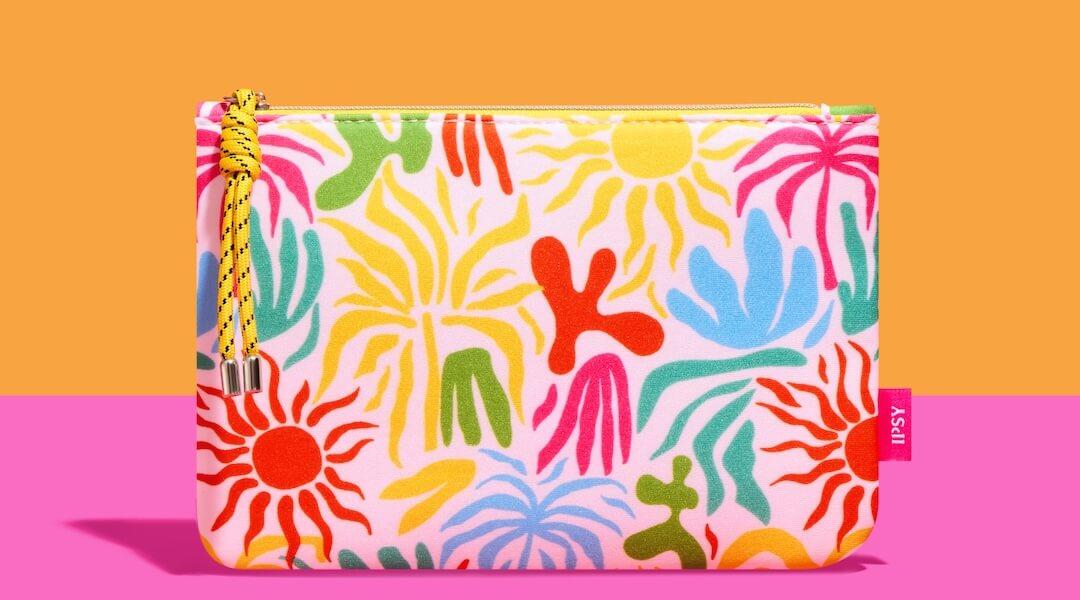 June 2024 IPSY Glam Bag over a pretty pink and orange background Desktop