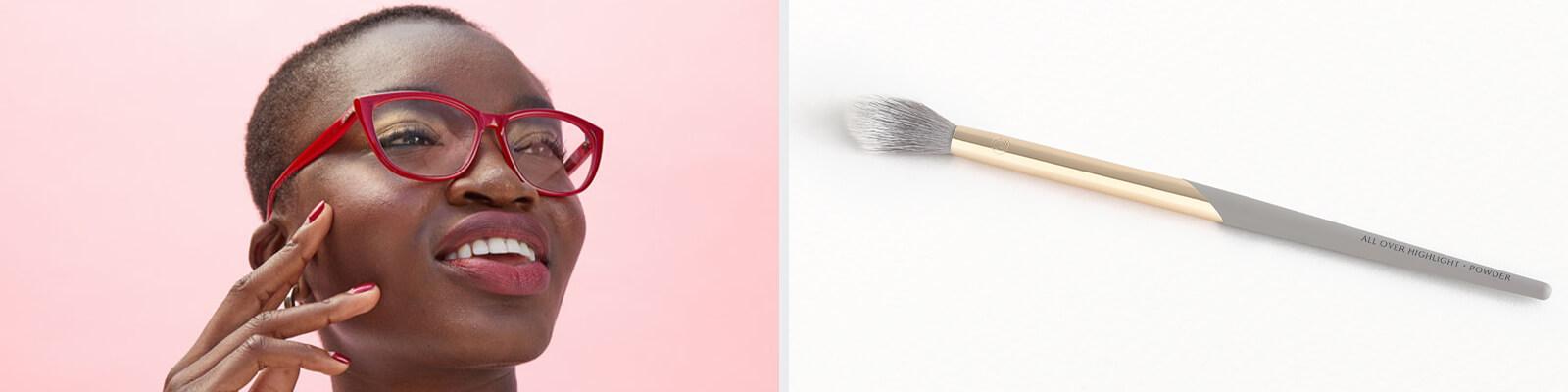 An image of a model wearing red frames eyeglasses holding her cheek and COMPLEX CULTURE All Over Highlight•Powder Brush Desktop