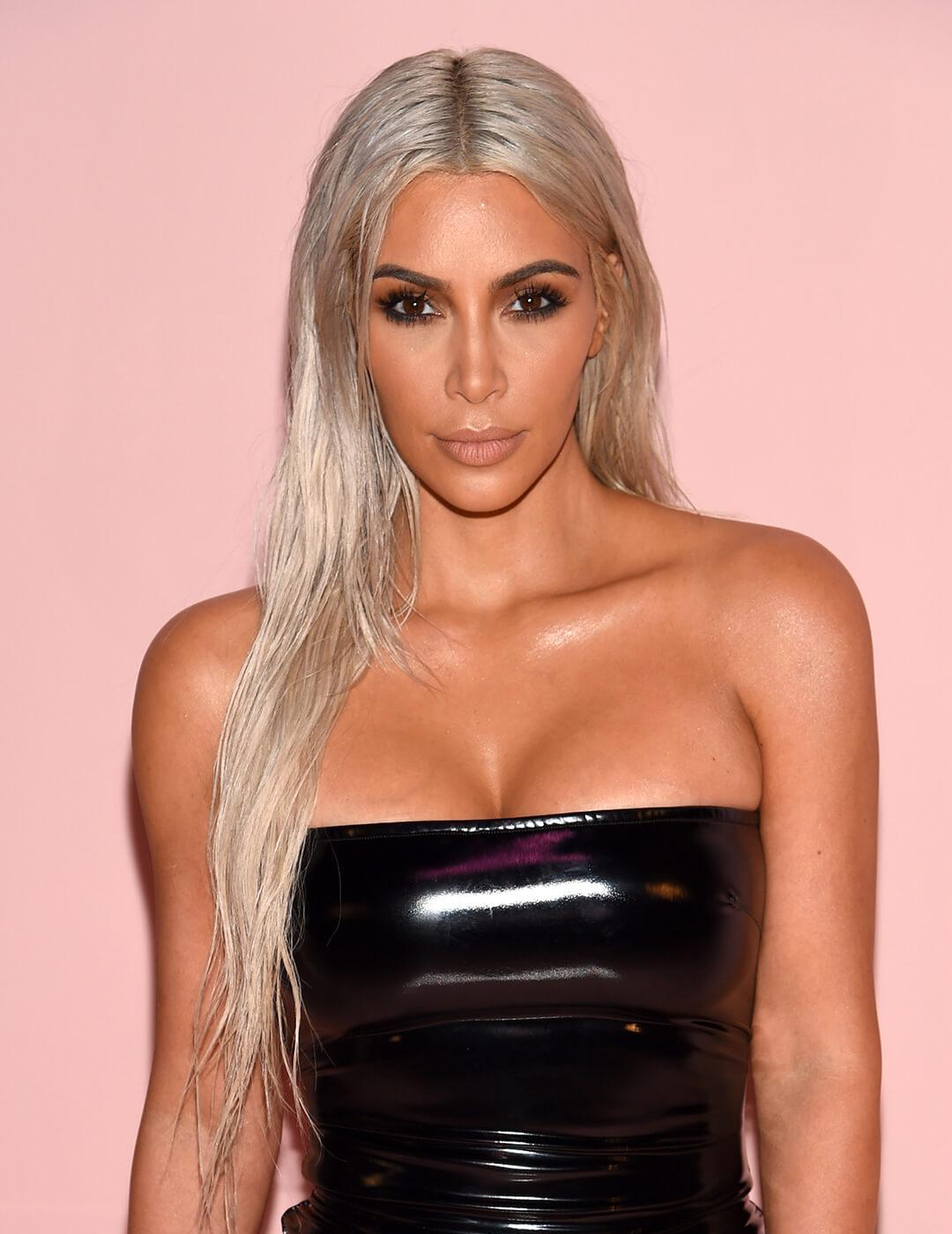 A photo of Kim Kardashian being sexy with a silver blonde hair color Desktop