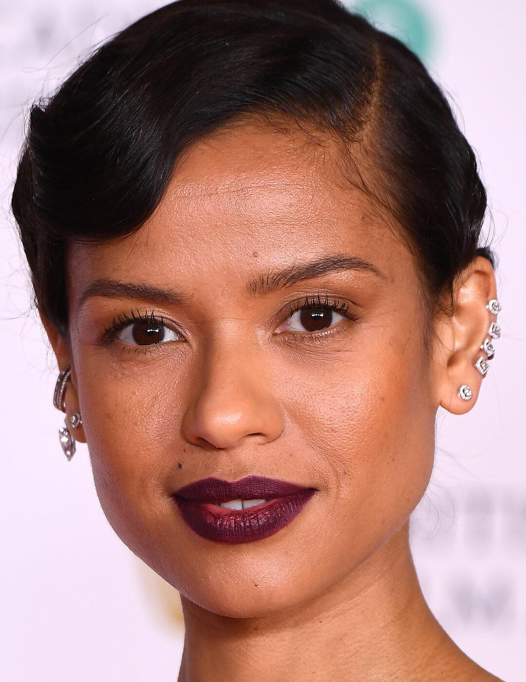 A photo of Gugu Mbatha-Raw with a bold mauve lip Desktop