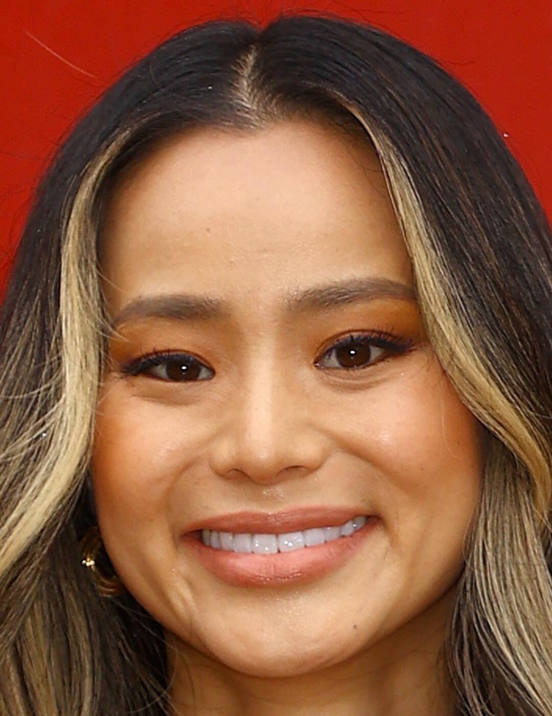 A photo of Jamie Chung with a peachy monochrome look Mobile