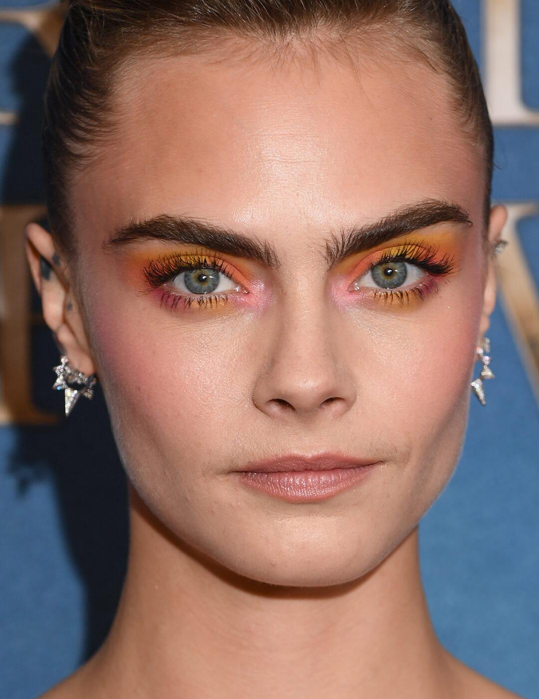Close-up of Cara Delevingne rocking a watercolor sunset eye makeup look Mobile