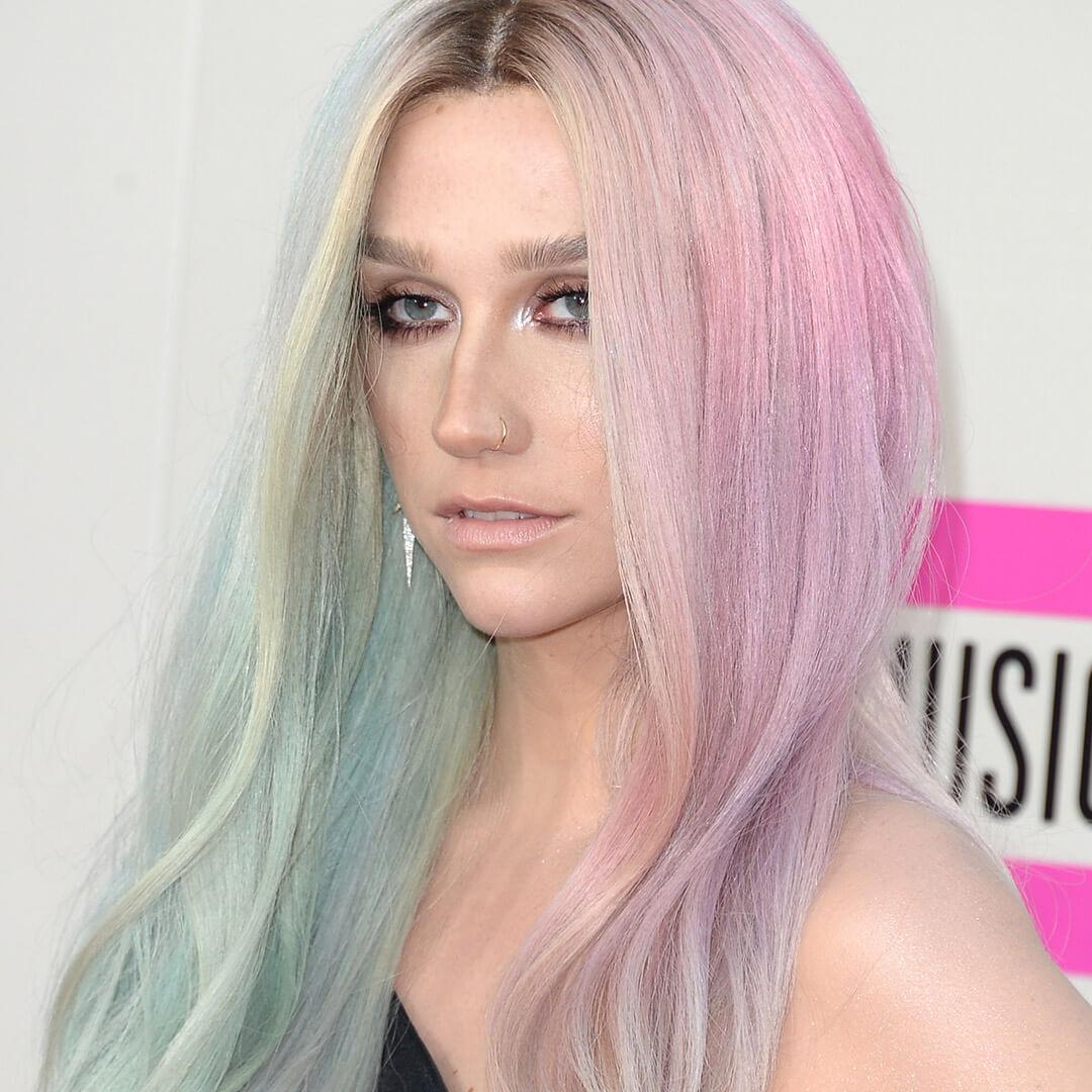 A photo of Ke$ha with a split of pastel blue and pink Desktop