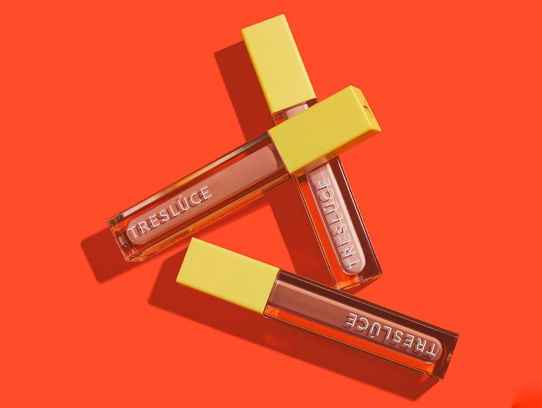 TRESLÚCE BEAUTY Se Preparó Eyelid Primer in various shades on dark orange background Desktop