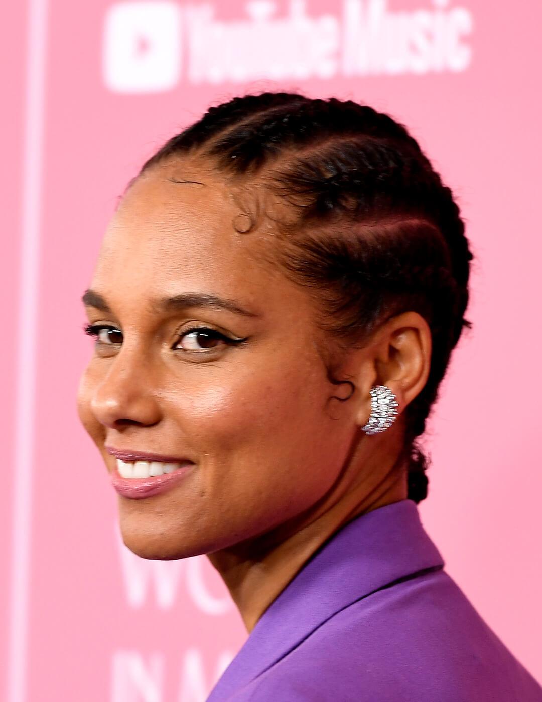 Alicia Keys in a purple suit rocking a cornrows braided hairstyle Mobile