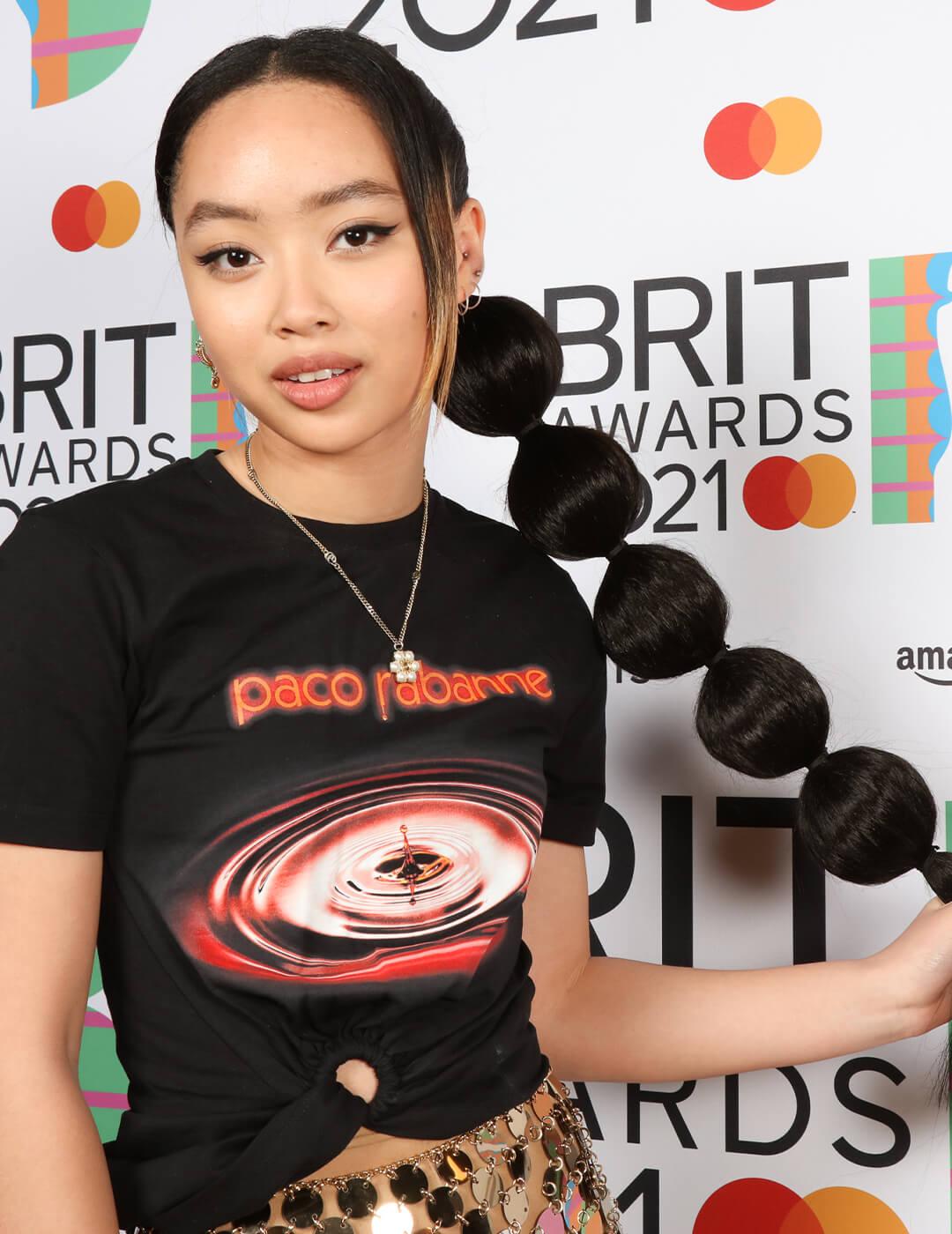 Griff holding her mega bubble ponytail hairstyle Mobile