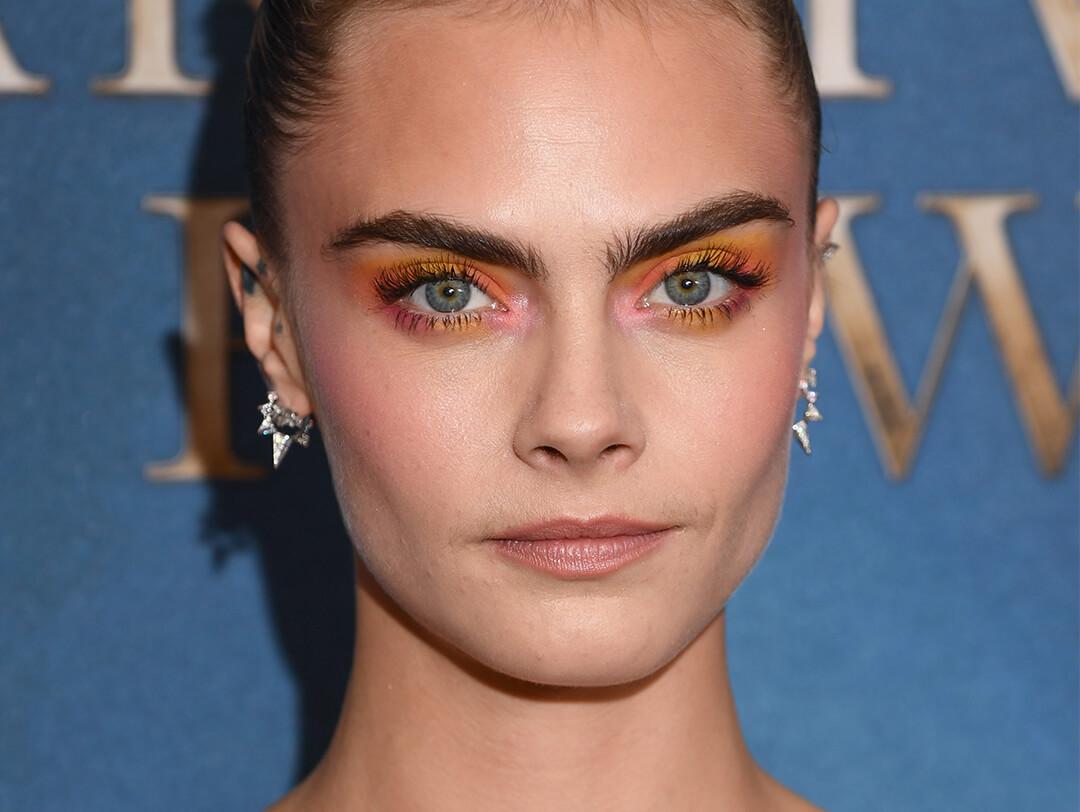 Close-up of Cara Delevingne rocking a watercolor sunset eye makeup look Desktop
