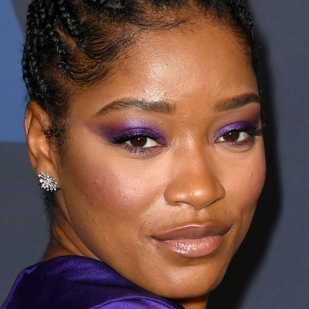 Close-up image of Keke Palmer rocking a bold purple eyeshadow makeup look Desktop