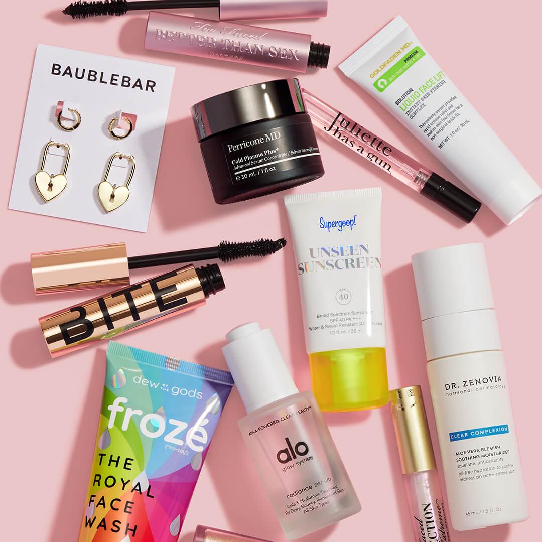 Beauty, makeup, skincare, and hair care products and accessories on pink background Mobile