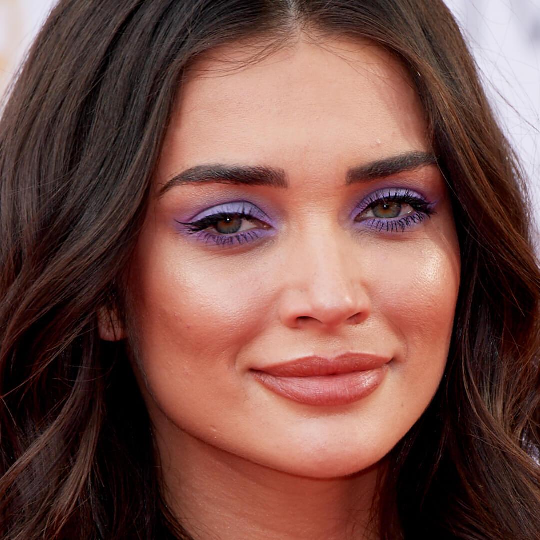Close-up image of Amy Jackson rocking a shimmery purple and blue eyeshadow look Mobile