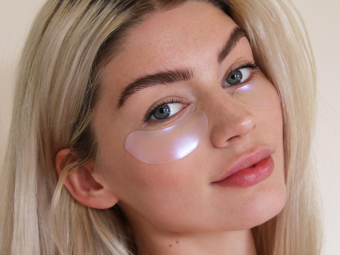 A close-up photo of a model with under-eye masks Mobile