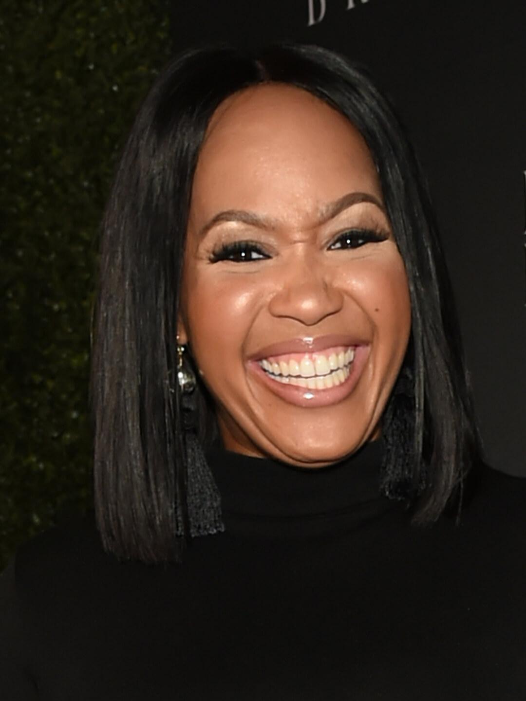 Goo Goo Atkins with straight hair smiling Mobile