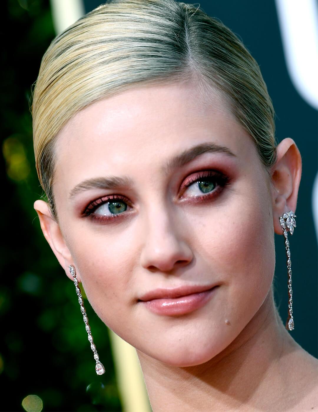 Close-up of Lili Reinhart rocking a cranberry and burgundy eyeshadow look Mobile