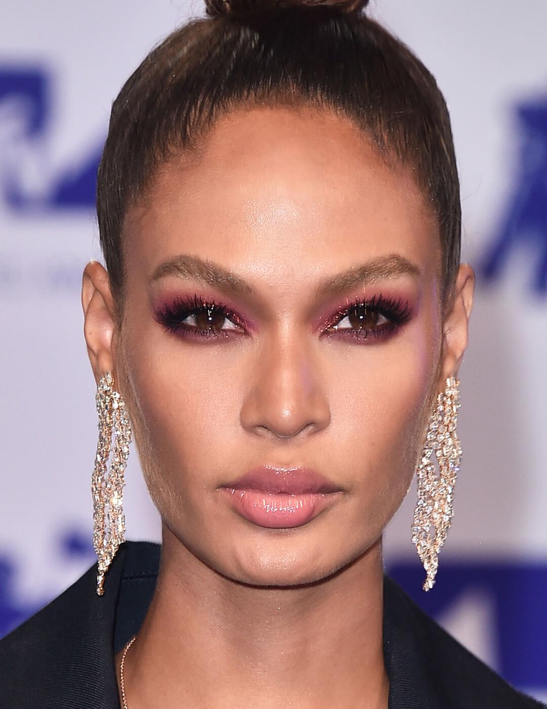 Joan Smalls rocking a mauve smoky eye makeup look paired with nude lips Desktop