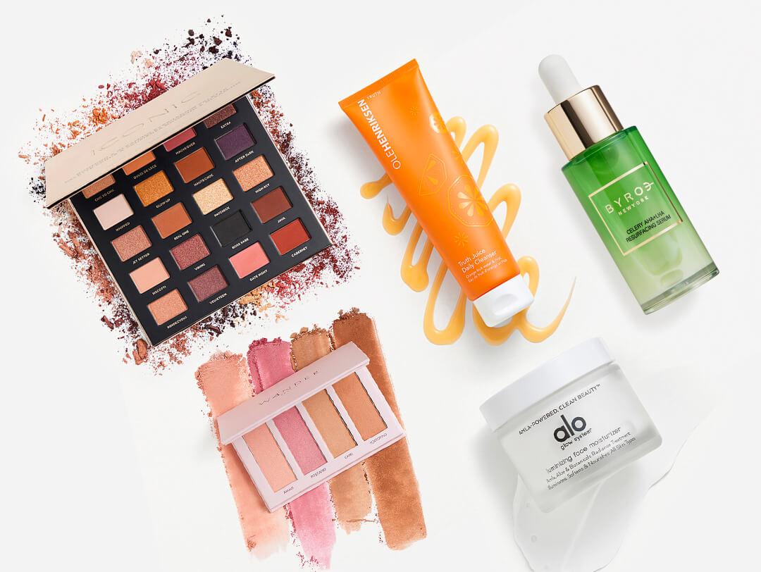 Skincare and makeup products from various brands on white background Desktop