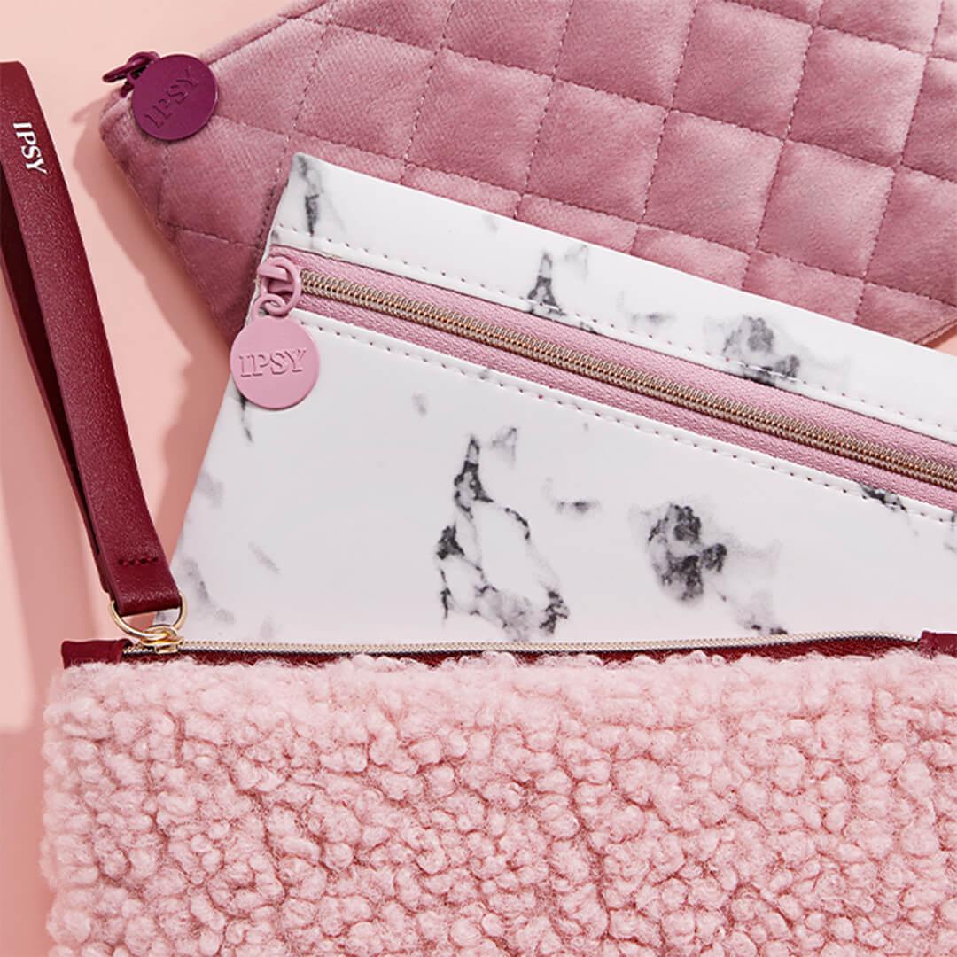 Pink-themed IPSY Glam Bags arranged on pink background Mobile