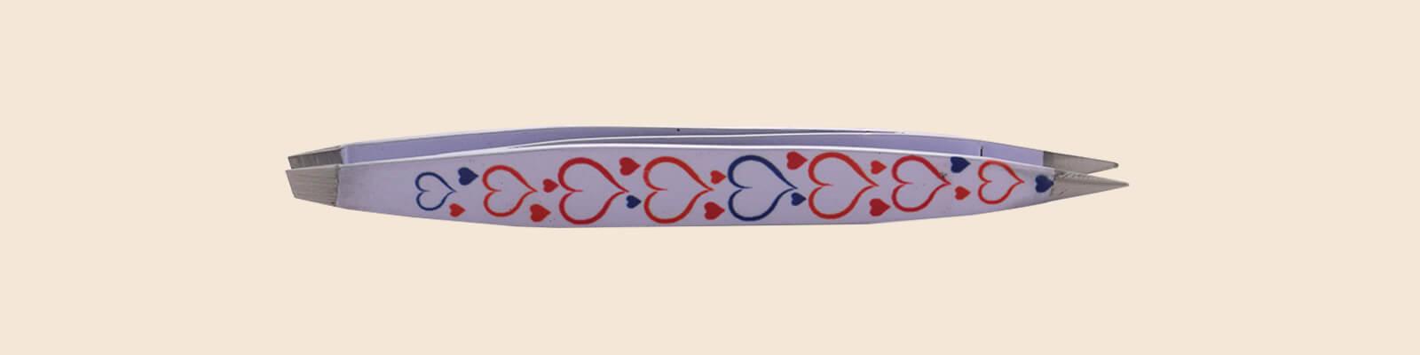 An image of a double-sided pair of tweezers decorated with hearts. Desktop