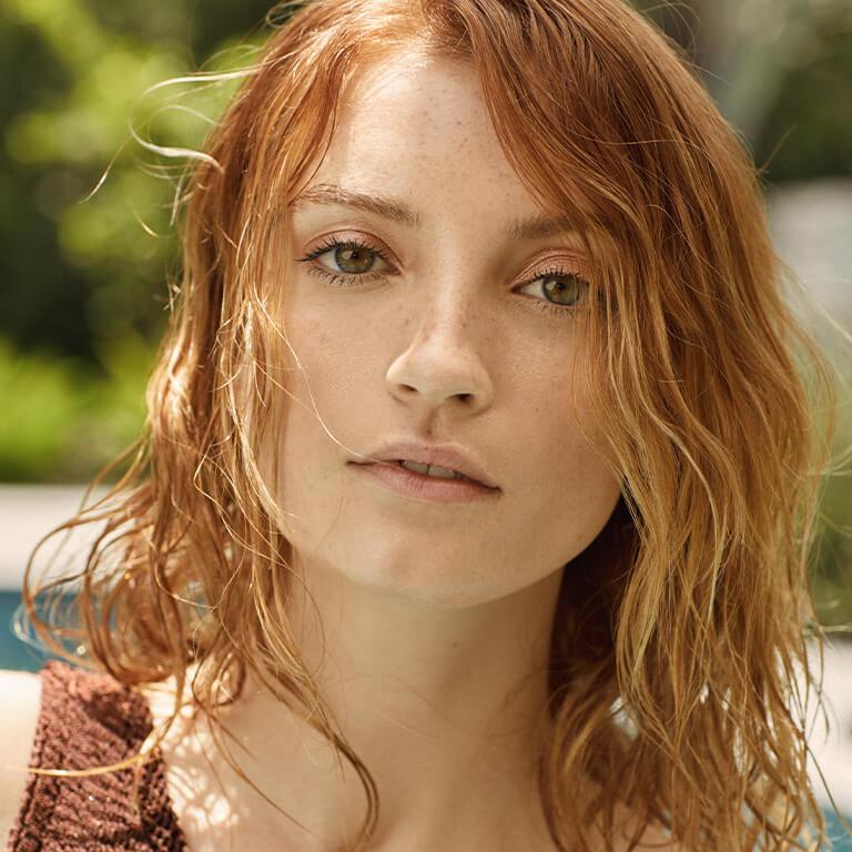 An image of red haired model with wet hair look and an image of a brunette model with wet hair look Mobile