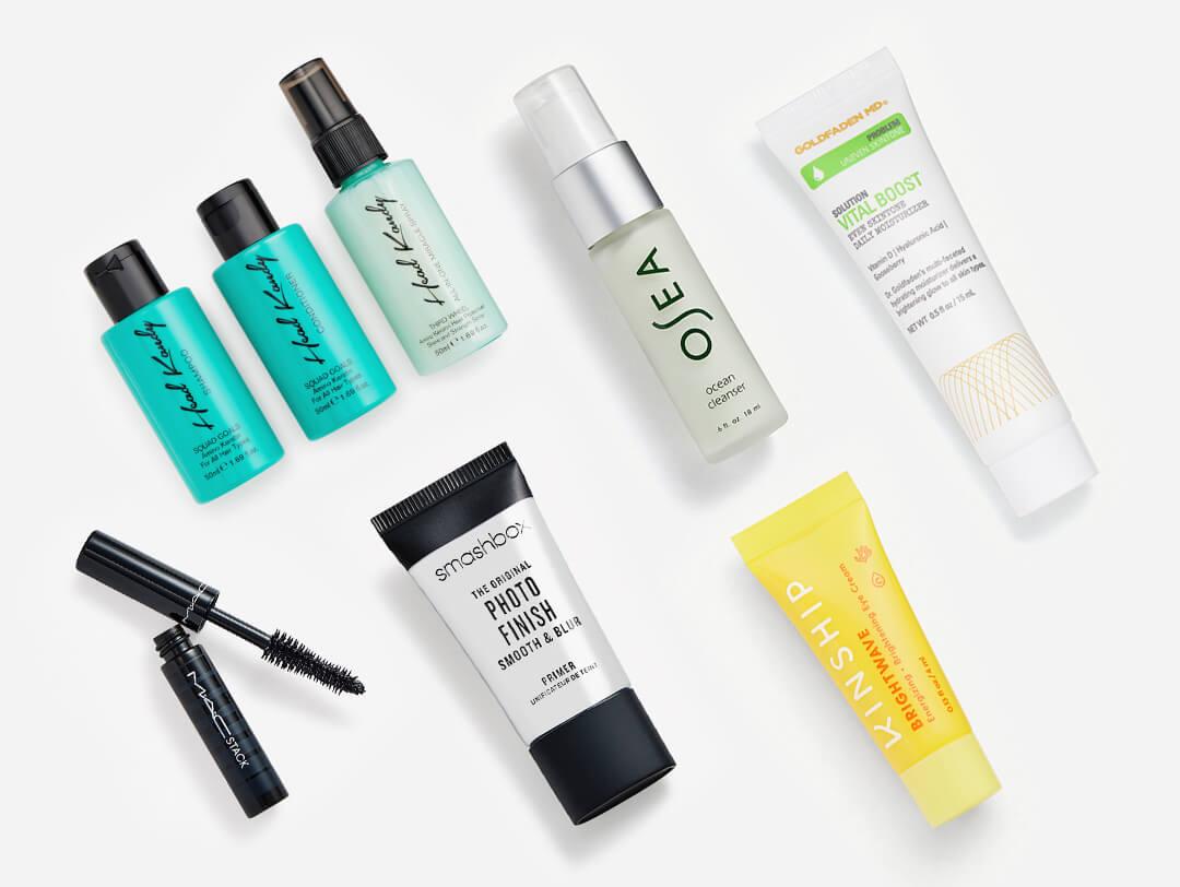 Makeup, skincare, and hair care products from the July 2022 IPSY Glam Bag on white background Desktop