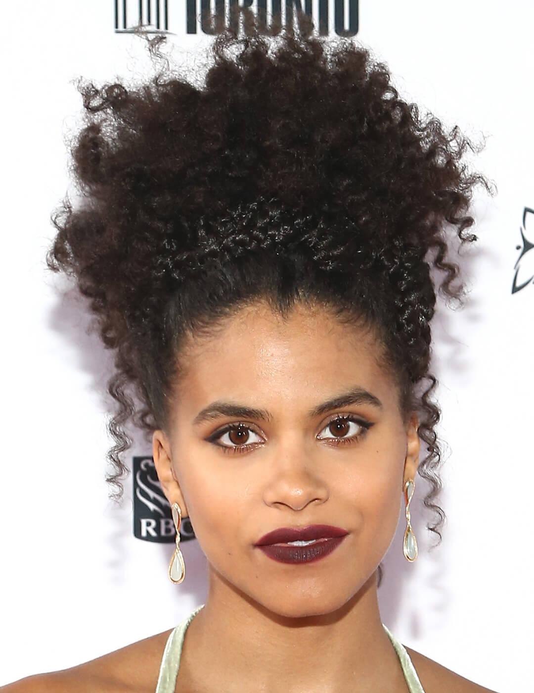 Zazie Beetz rocking a braided headband hairstyle to hold her natural curls Mobile