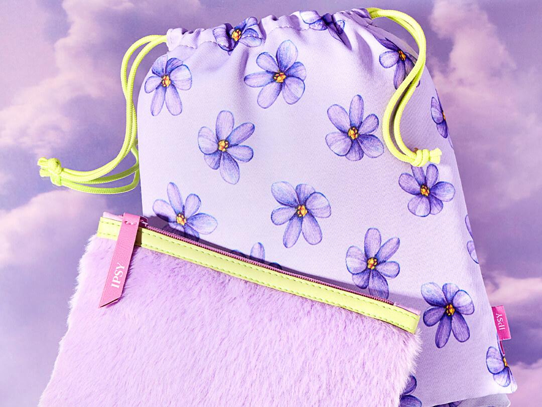 January 2023 IPSY Glam Bag and Glam Bag Plus bags on purple clouds background Desktop