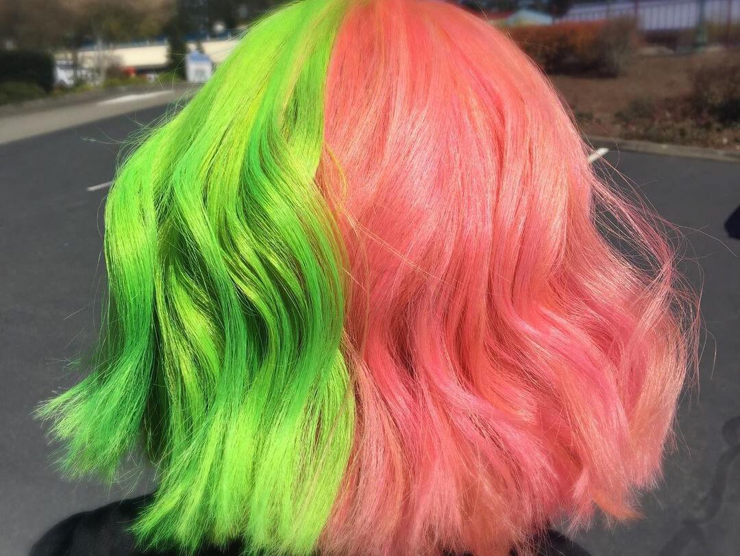 Image of a woman's neon green and pink split hair color Desktop