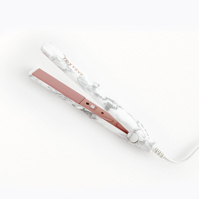 Ipsters signed up to receive a January Glam Bag Plus might receive FOXYBAE Mini Travel Flat Iron in Marbled Desktop