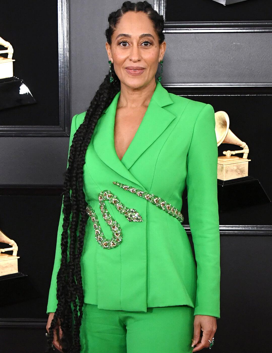 Tracee Ellis Ross rocking a neon green suit with snake belt and long braided ponytail with cornrows Mobile