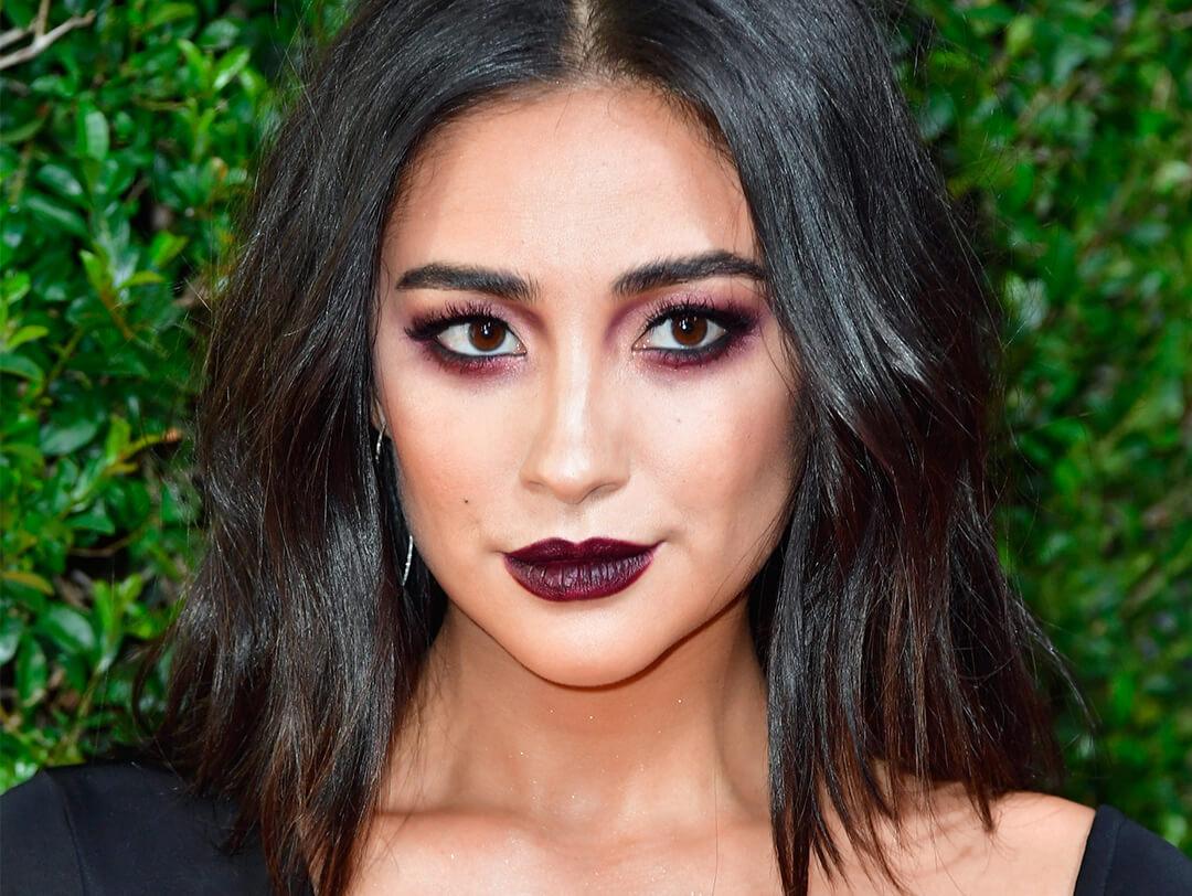 Close-up of Shay Mitchell rocking dark berry smoky eyeshadow and dark berry lips makeup look Desktop