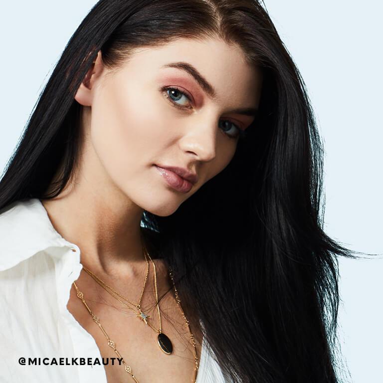 Micaela Klein smiles after using leave-in conditioner. Mobile