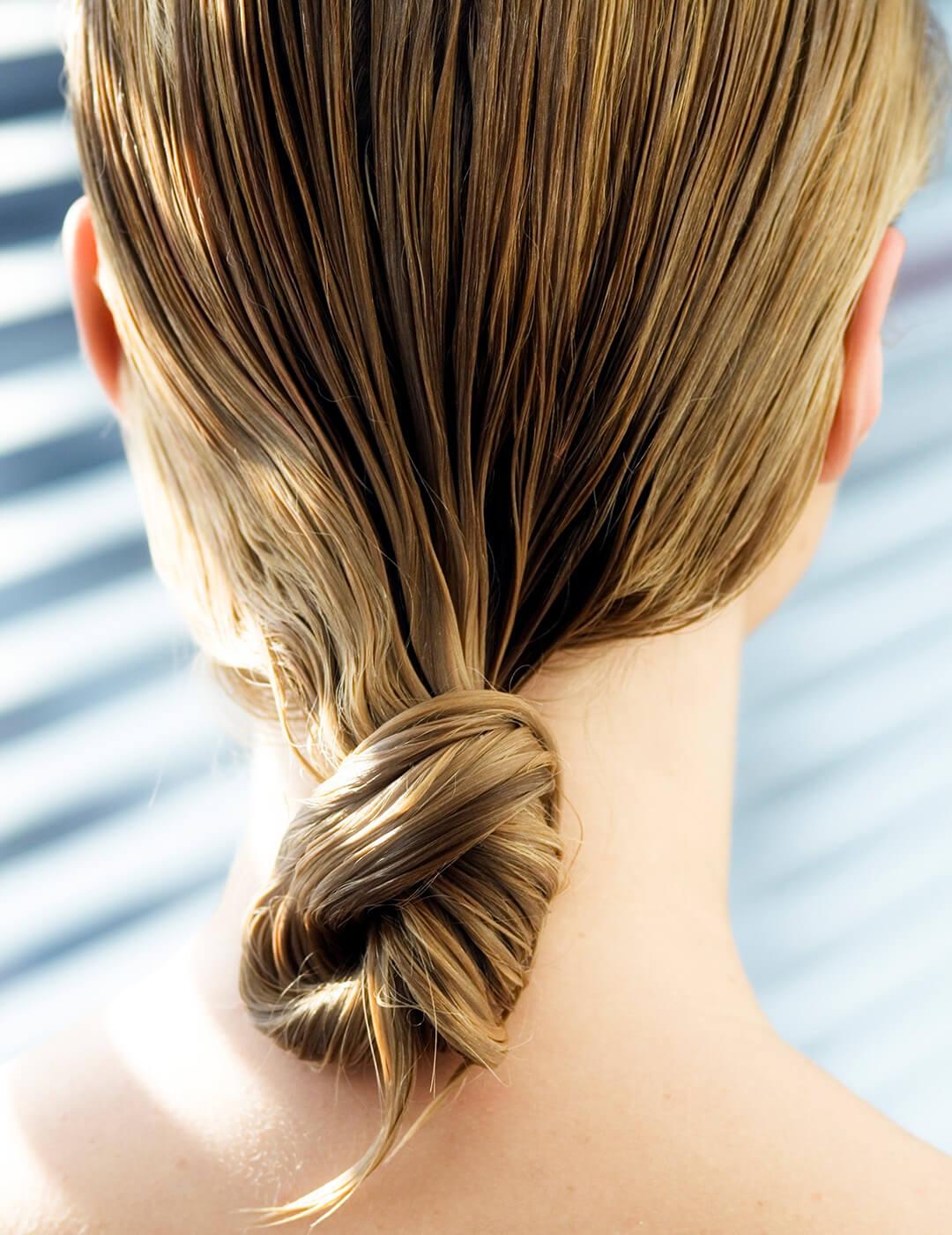 A photo showing a hair tied together in a single knot Mobile