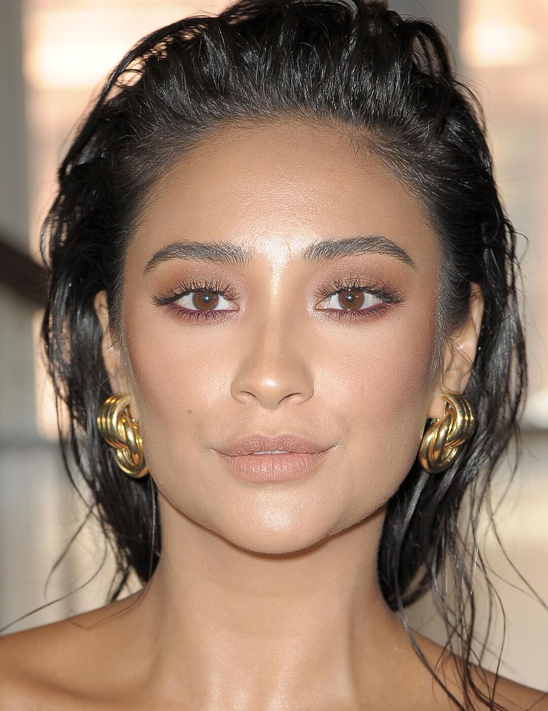 Close-up of Shay Mitchell rocking a neutral eyeshadow and burgundy eyeliner makeup look Mobile