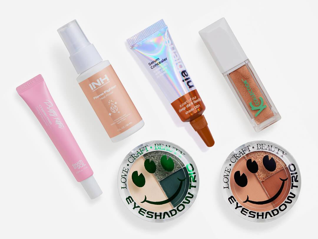 Hair care, makeup, and skincare products from the July 2023 IPSY Glam Bag Desktop